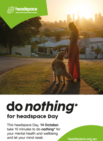 Headspace Day poster featuring a person walking a dog at sunset, overlooking a city. Text reads “do nothing* for headspace Day” and “This headspace Day, 14 October, take 10 minutes to do nothing* for your mental health and wellbeing and let your mind reset.” The headspace logo appears at the top left and headspace.org.au at the bottom.