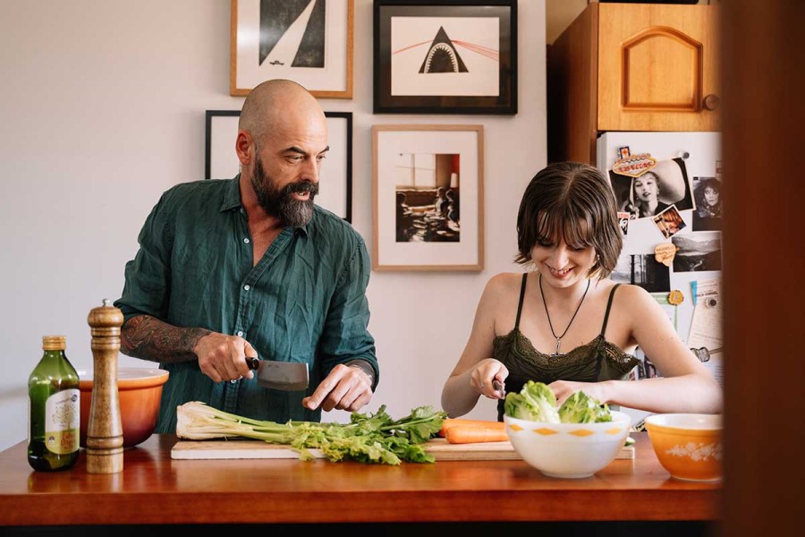 parent and young person cooking